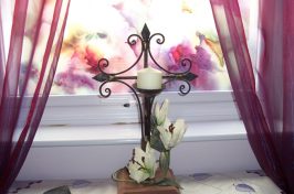 Candle tribute by windowsill